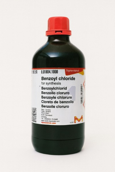 "Sigma-Aldrich Benzoyl chloride for synthesis, 1-liter dark glass bottle with red cap on a white background"
